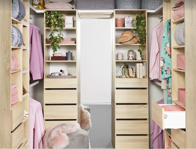 Stylish walk-in wardrobe by 7am Wardrobes in Sydney, featuring custom-built drawers, shelving, and organised hanging space—showcasing premium built-in wardrobe design.